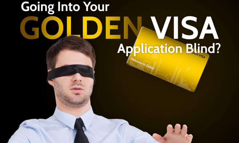 Blindfolded man in shirt and tie reaching out toward a golden Welcome to Dubai card, captioned going into your Golden Visa application blind