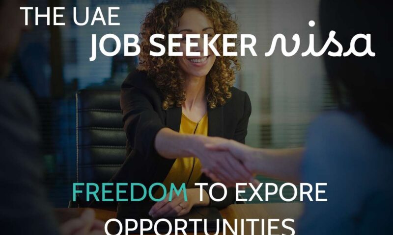 Smiling woman in business attire shaking hands across a boardroom table, captioned the UAE job seeker visa, freedom to explore opportunities