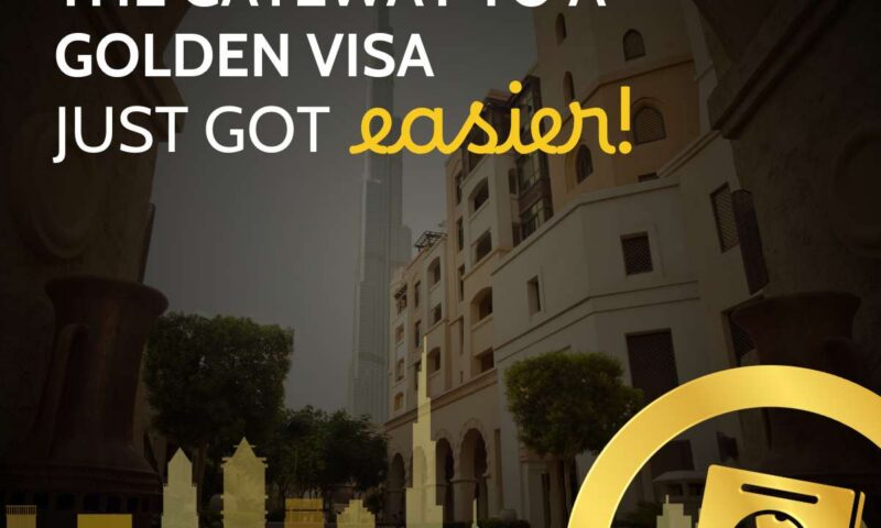 Arched view of an old Dubai courtyard looking toward the Burj Khalifa, captioned the gateway to a Golden Visa just got easier, with gold passport icon