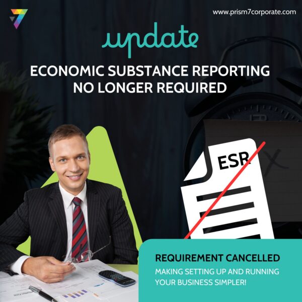 Smiling businessman in pinstripe suit at a desk beside an ESR document graphic with red strike-through, captioned update, Economic Substance Reporting no longer required